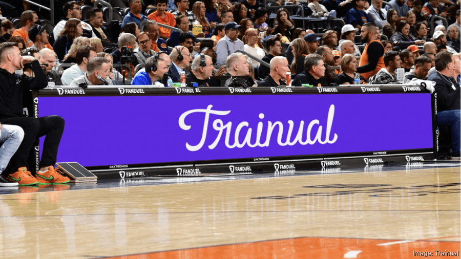 Real estate team collaborating in a modern office setting representing structured onboarding and training processes for brokerages