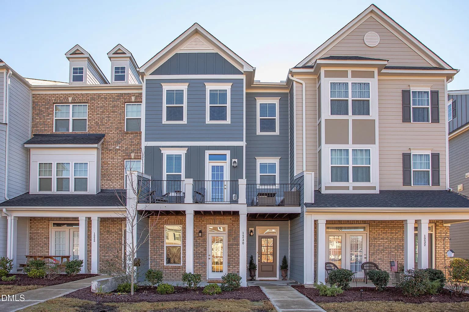 Modern townhomes with sophisticated brick and siding exteriors