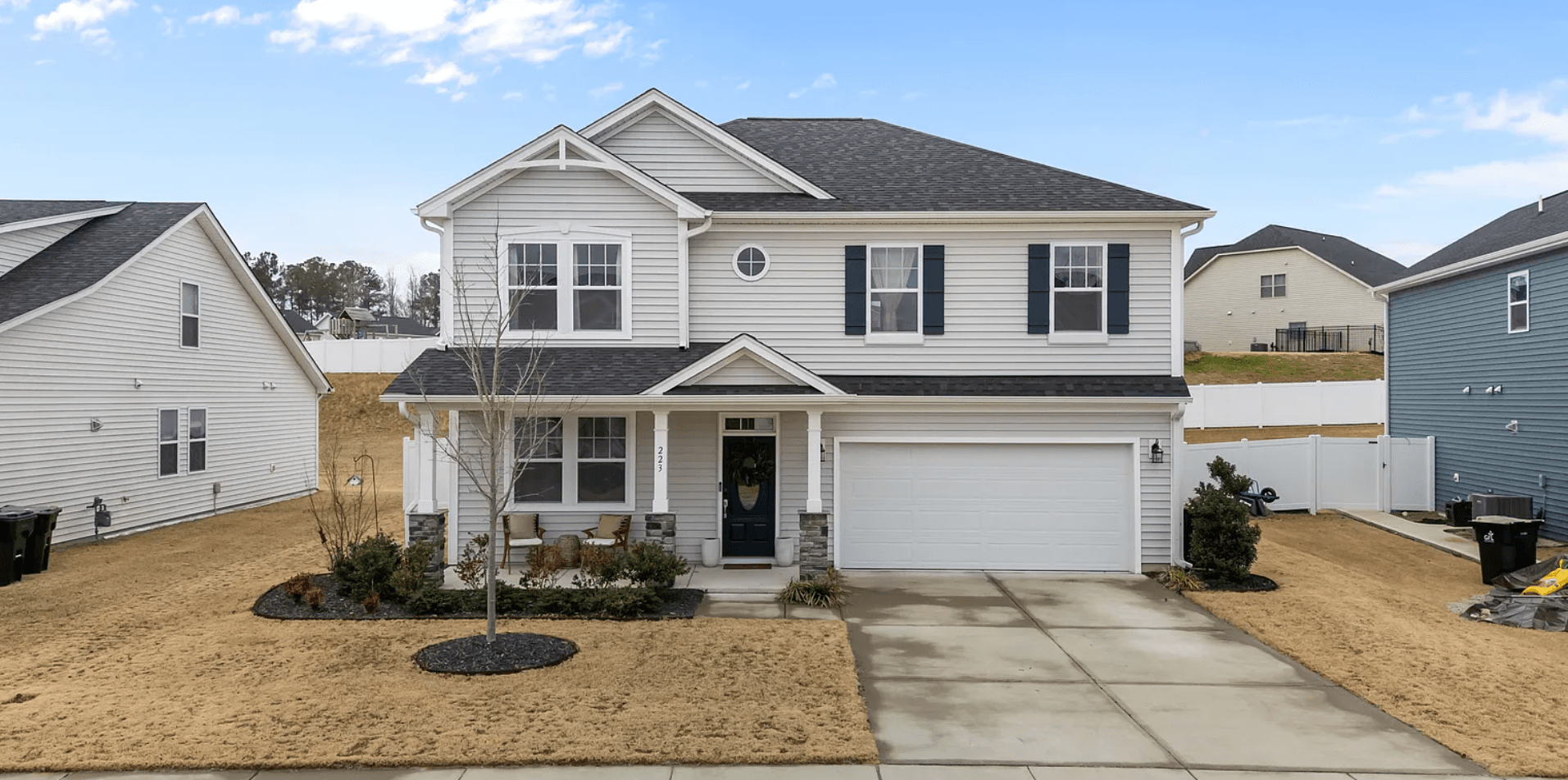 Modern two-story home with pristine landscaping and stonework